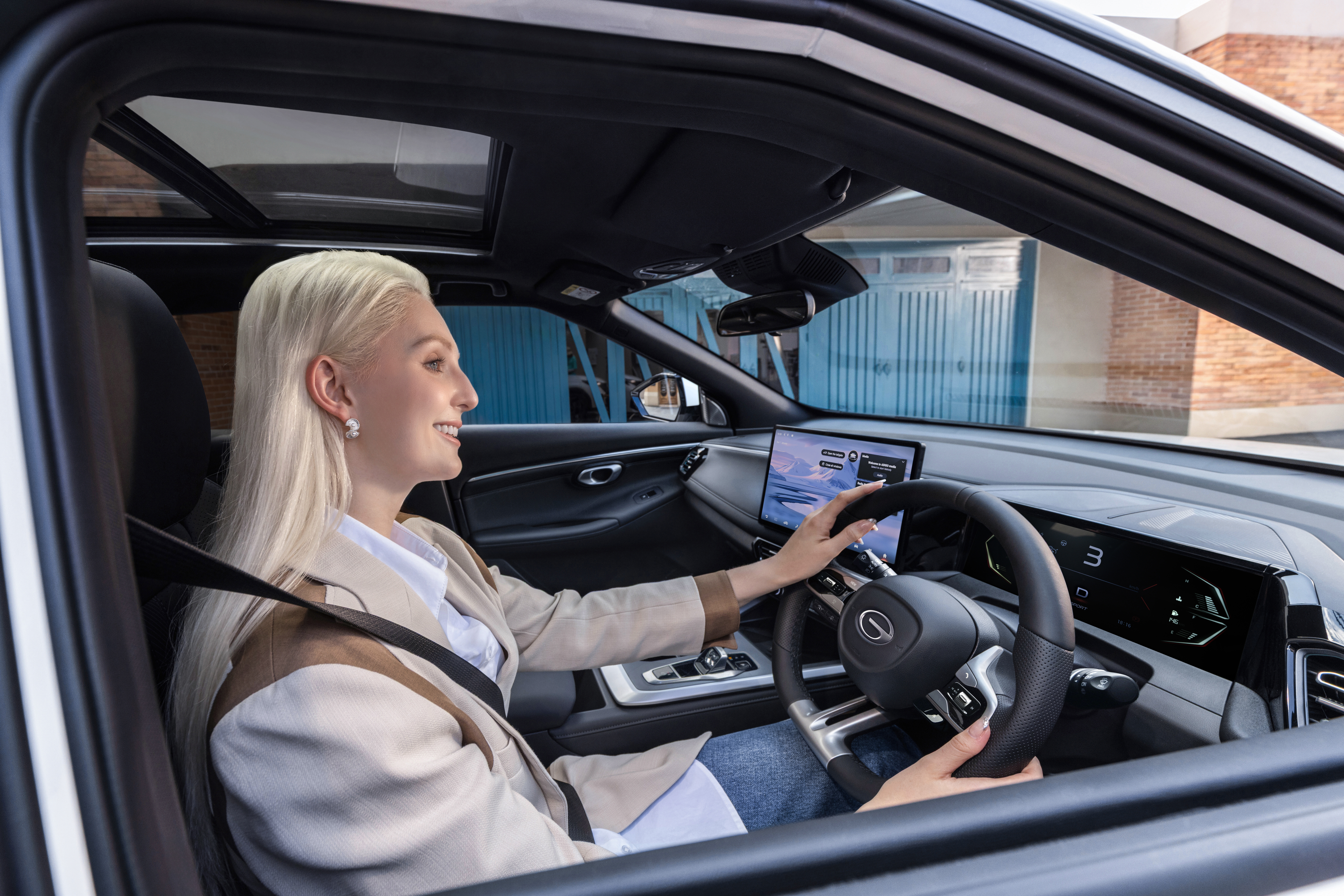 A woman who is driving GAC EMZOOM